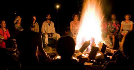 Students around a campfire.